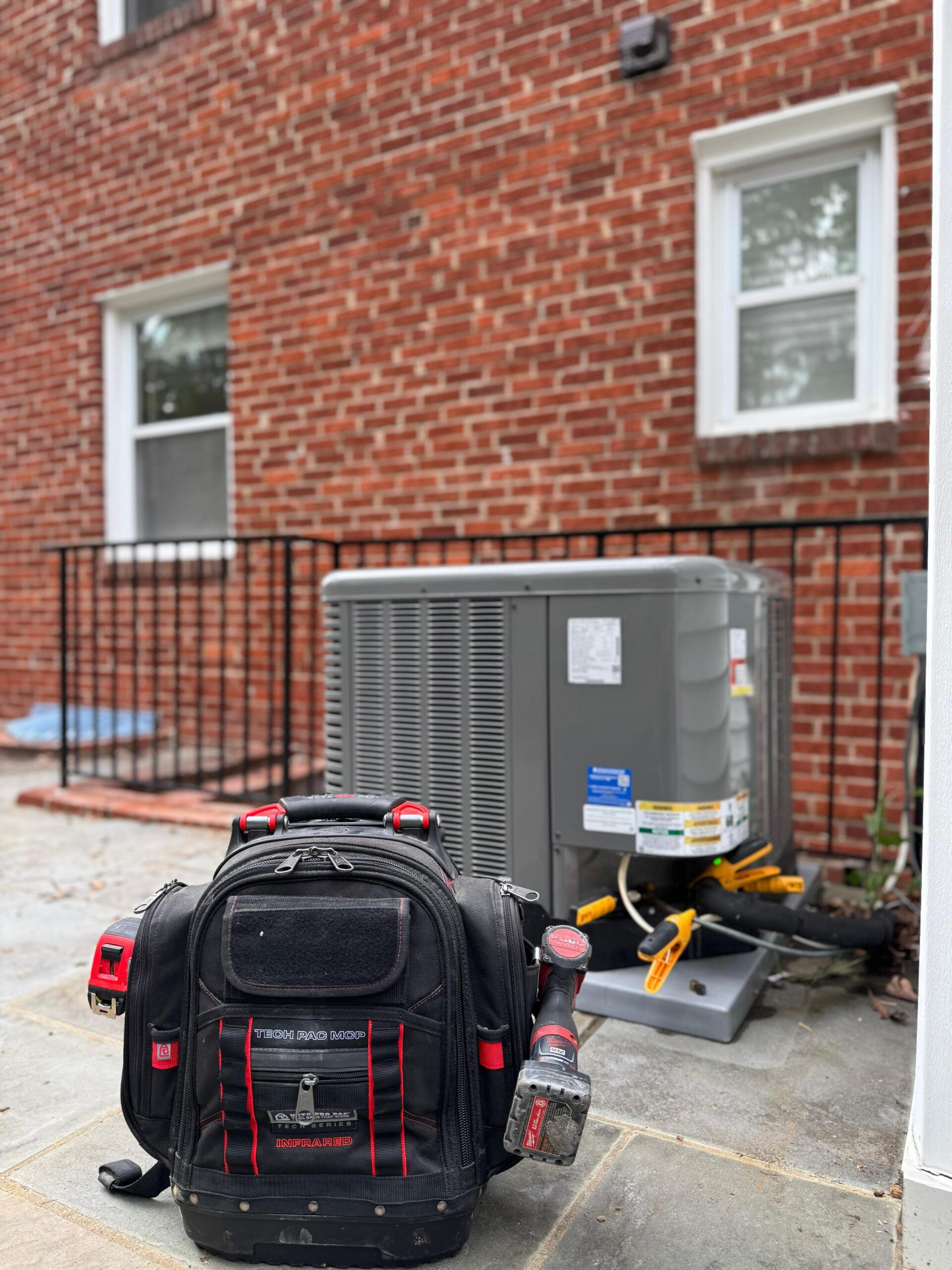 HVAC technician working on an air conditioning unit
